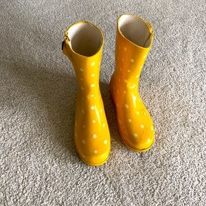 Yellow polka dotted rain boots